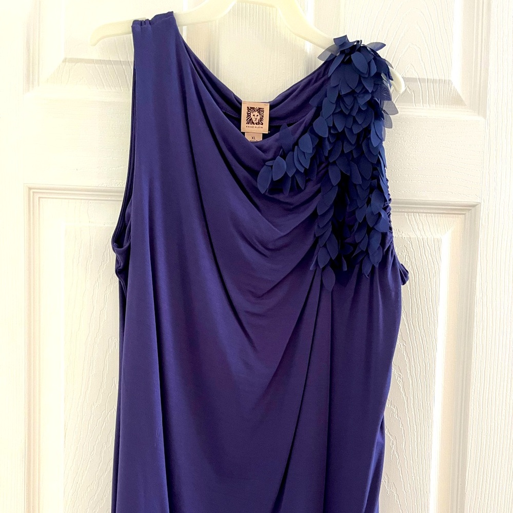 Deep indigo blue, left shoulder leaf like design